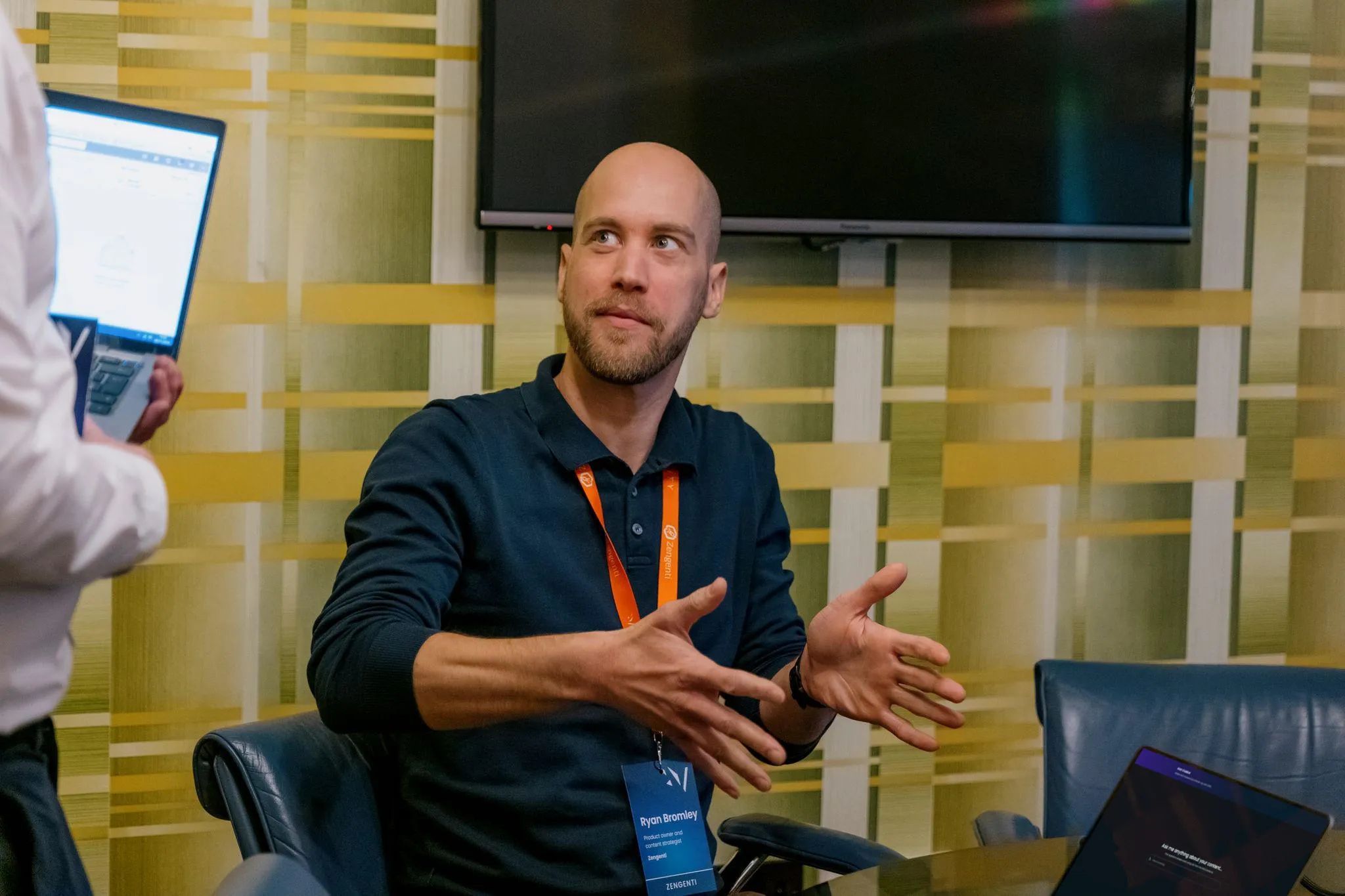 Ryan Bromley showing a Contensis customer a prototype of Zengenti's RAG search product at Velocity 2025.