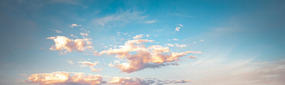 A wide banner taken from the top of the coastal landscape, showing only sky and cloud