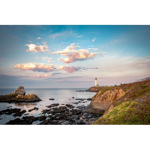 The coastal landscape padded to a square with white bands above and below
